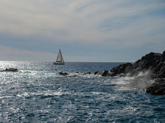 sail boat at horizon line