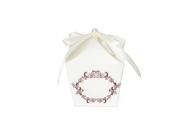 A white box on a white background. Gift. Box with ribbon and pearl.