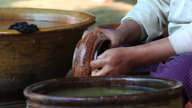 BAGAN, MYANMAR -  Burmese man working in a factory of lacquer. Lacquerware includes boxes, tableware, buttons and souvenirs