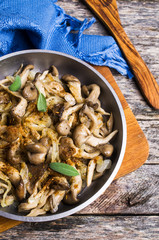 Fried oyster mushrooms with onions
