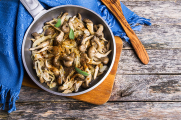 Fried oyster mushrooms with onions