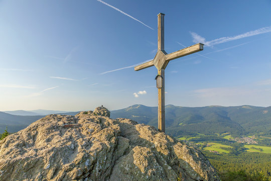 Wooden cross on the summit of a mountain Grosser Osser in National park Bavarian forest, Germany.
