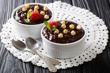 chocolate cream with hazelnuts, mint and raspberries close-up. horizontal