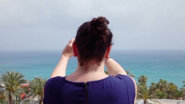 High quality video of woman taking a picture on the vacation in real 1080p slow motion 120fps