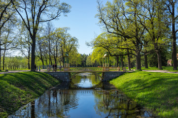 Fototapeta na wymiar Bridge across canal in Alexander's park