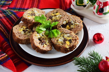 Meat roll stuffed with eggs, olives, sundried tomatos.