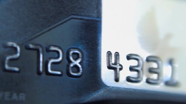 Credit card moving through the reader