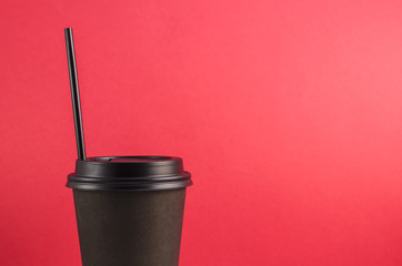 Closed Coffee Cup on red background.