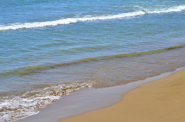 Beautiful white soft wave on empty tropical beach and blue sea