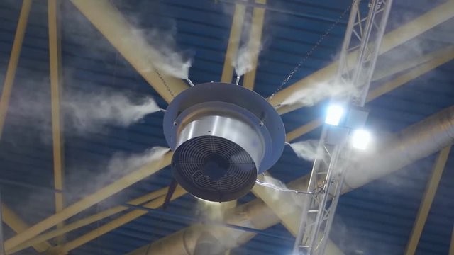 The industrial air humidifier at the ceiling of the hangar maintains the optimum humidity level at the site. Slow mo, slo mo, slow motion, high speed camera, 240fps, 250fps
