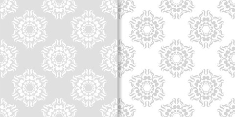 Light gray floral backgrounds. Set of seamless patterns