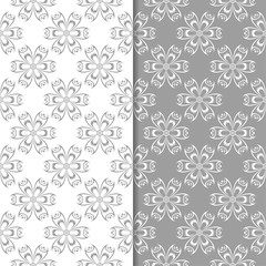 White and gray floral ornaments. Set of seamless backgrounds