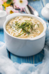 Tasty mushroom soup with noodles on a wooden table.
