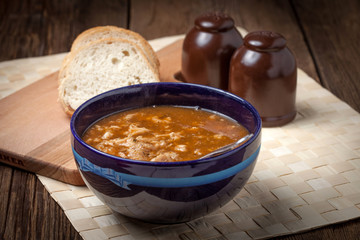 Traditional polish tripe soup with vegetables.