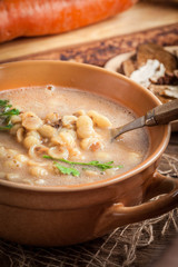 Mushroom soup on a wooden table.