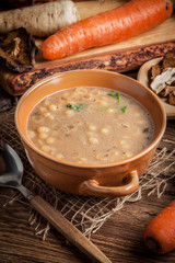 Mushroom soup on a wooden table.