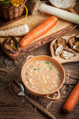 Mushroom soup on a wooden table.