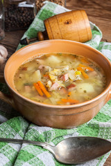 Pea soup with vegetables and bacon.