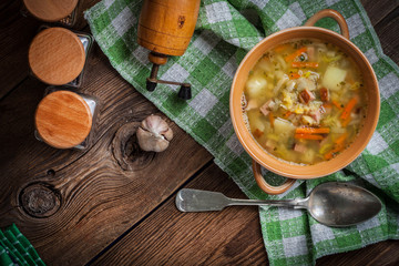 Pea soup with vegetables and bacon.