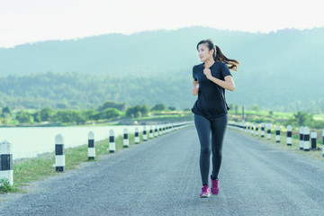 Young woman jogging in nature