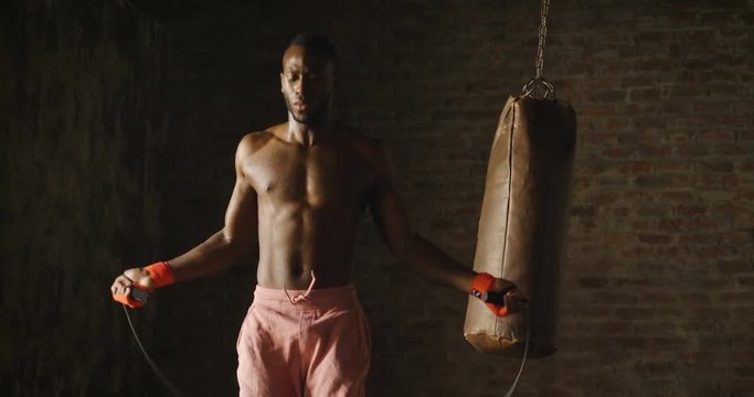  00:14 | 00:17 1&times;  A muscular and sweaty man is training at the gym by lifting the gym weights to strengthen his muscles. Concept of: workout, workout, power, supplements, fitness