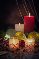 Christmas decorated Burning candles on wooden rustic background with christmas decoration st