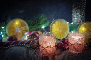 A Couple of Magic Christmas decorated Burning candles on wooden rustic background 3