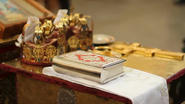 Crowns and prayers are prepared for holy ceremony of wedding, Orthodox Church