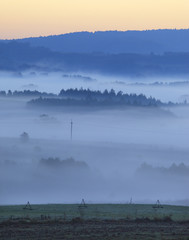 Fields and meadows under early morning fog - Podkarpacie region, Lesser Poland province, Poland, near cities of Rzeszow and Krosno
