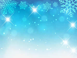 Illustration of Christmas background with blue and white snowflakes and bokeh