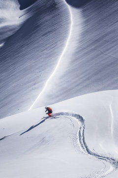 Freeride skier skiing through deep snow, Kuhtai in Austria