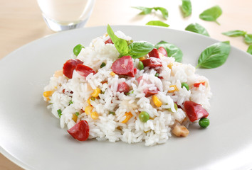 Plate with rice, sausage and vegetables, closeup