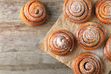Sweet cinnamon rolls on table