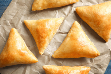 Delicious baked samosas on parchment
