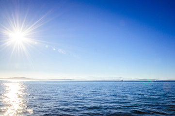 Sun shining on the water in Seattl bay area