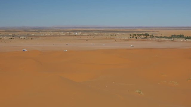 Four wheel drives in the Sahara, traditional entertainment for tourists in Moroccan desert  4K
