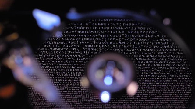 The hdd starts working, the head moves over the disk, the running symbols are reflected on its surface. Top view. Macro. Closeup. Jib arm