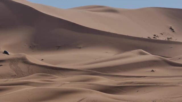 Four wheel drives in the Sahara, traditional entertainment for tourists in Moroccan desert  4K