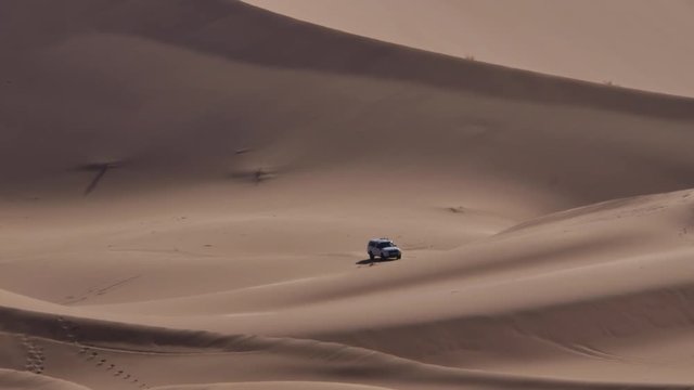 Four wheel drives in the Sahara, traditional entertainment for tourists in Moroccan desert  4K