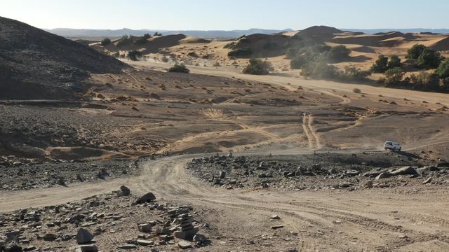 Four wheel drives in the Sahara, traditional entertainment for tourists in Moroccan desert  4K