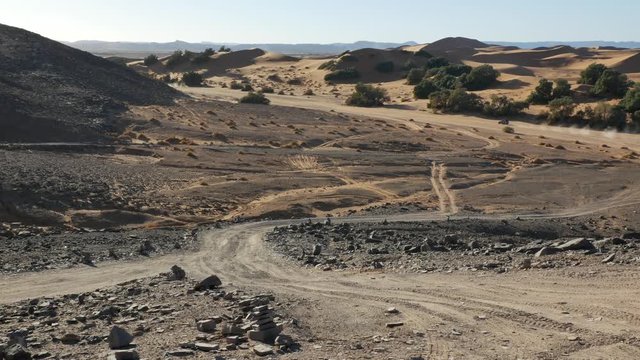 Four wheel drives in the Sahara, traditional entertainment for tourists in Moroccan desert  4K