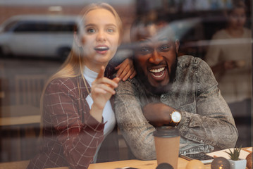 Happy bearded man looking at camera
