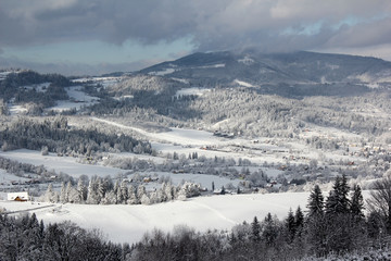  Panorama of mountain village in winter sun and snow