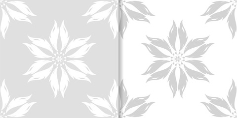 Light gray floral ornaments. Set of seamless patterns