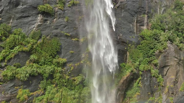 NEW ZEALAND &ndash; MARCH 2016 : Video shot of Milford Sound waterfall on a beautiful day from a boat with mountains in view