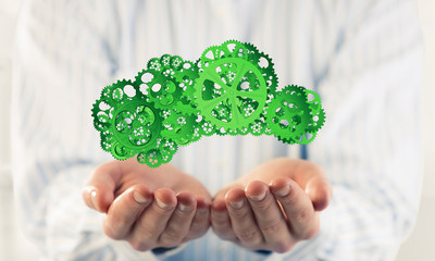 Man presenting in his palms cloud computing concept as mechanism