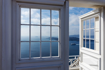 Open door with view of the Mediterranean Sea in Oia, Santorini