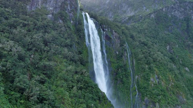 NEW ZEALAND &ndash; MARCH 2016 : Video shot of Milford Sound waterfall on a beautiful day from a boat with mountains in view
