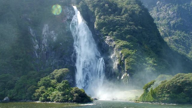 NEW ZEALAND – MARCH 2016 : Video shot of Milford Sound waterfall on a beautiful day from a boat with mountains in view
