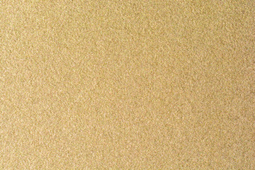 Fototapeta premium Details of golden texture background. Gold color paint wall. Luxury golden background and wallpaper. Gold foil or wrapping paper